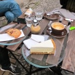 A slice of dangerously good cheese cake and various coffees