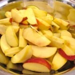 Apple wedges going into the home-made apple cake
