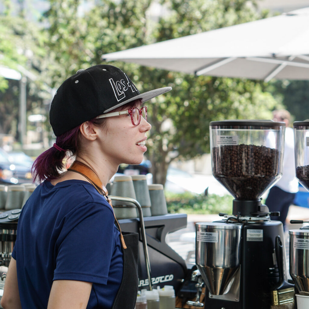 Barista chatting to customers