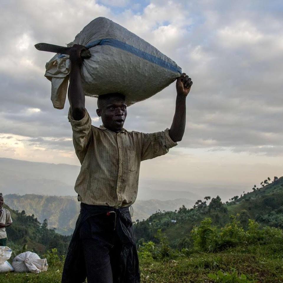 Man carrying a bag of coffee