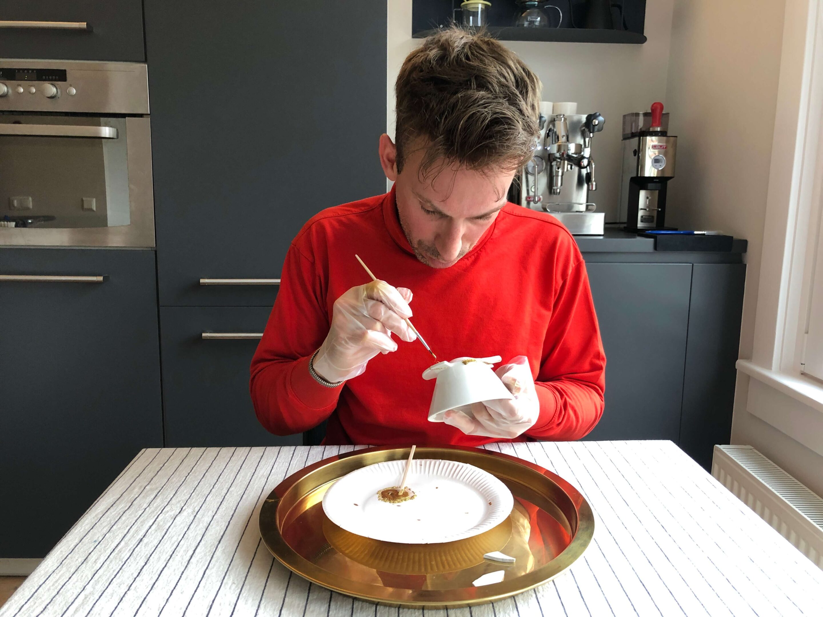 Man repairing ceramics