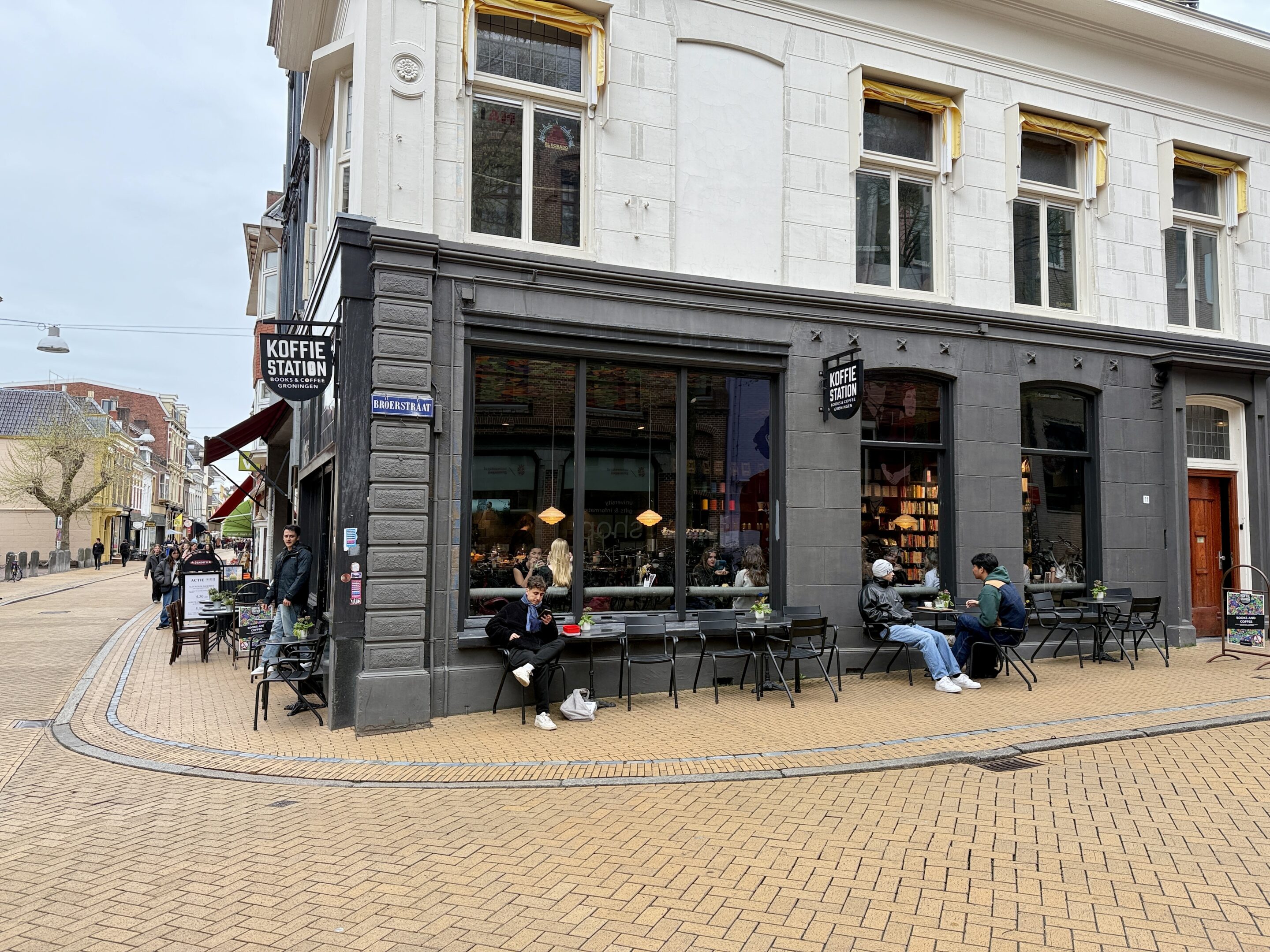 View of a corner shop with a bookstore inside