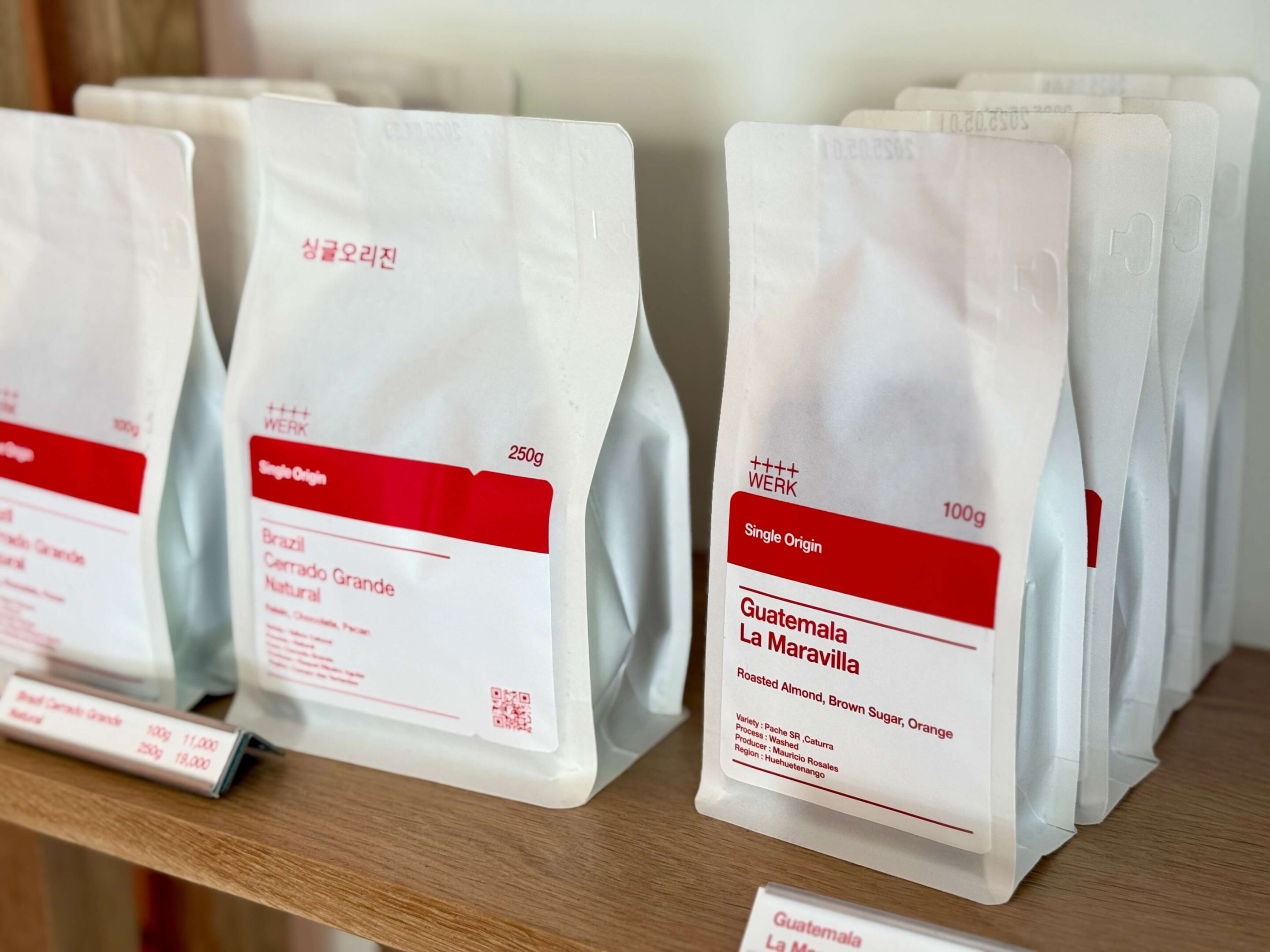 White coffee bags with red labels
