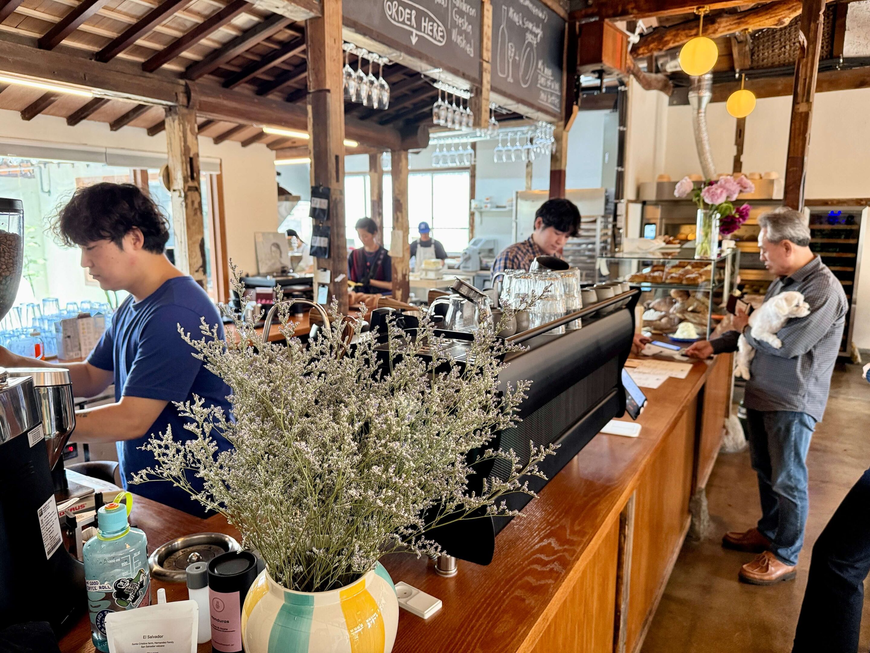 View of a coffee bar with a black espresso machine on top