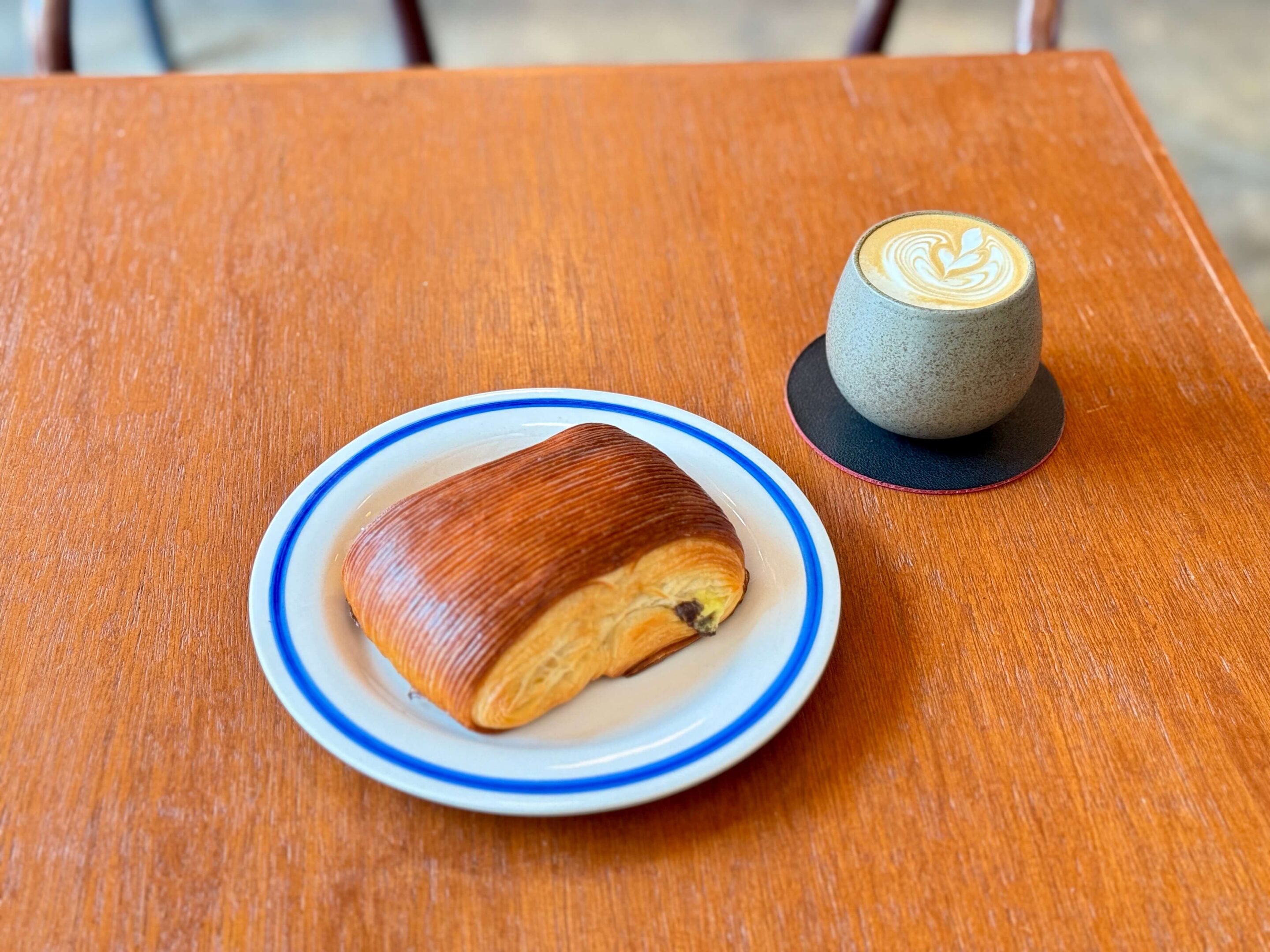 Pain au chcolat with a flat white