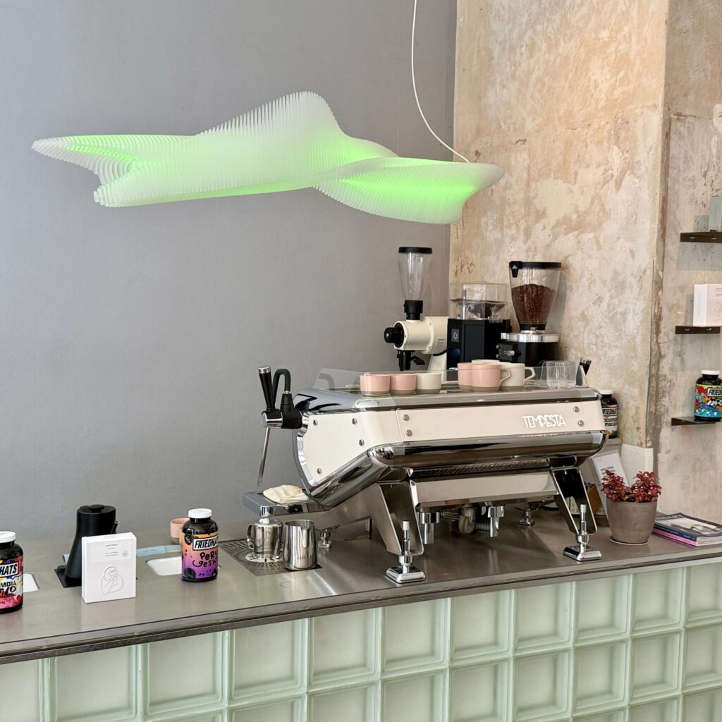 View of an espresso machine sitting on top of a bar