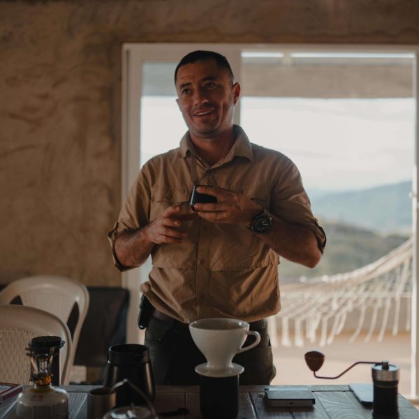 Man standing in front of a cupping table