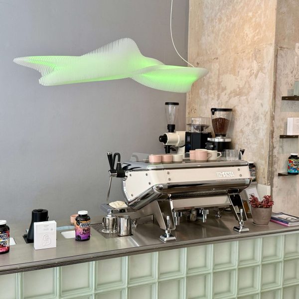 View of an espresso machine sitting on top of a bar
