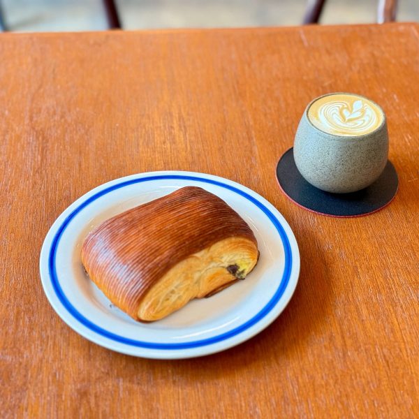 Pain au chcolat with a flat white